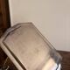 Art Deco metal plate, silvered, hammered on a flat vintage serving stand.