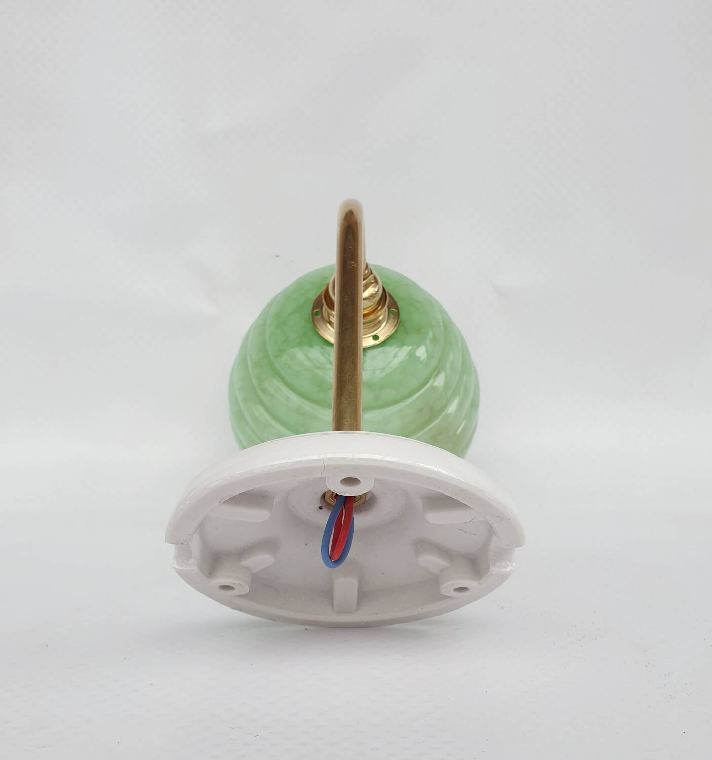 Brass collar and speckled glass wall lamp