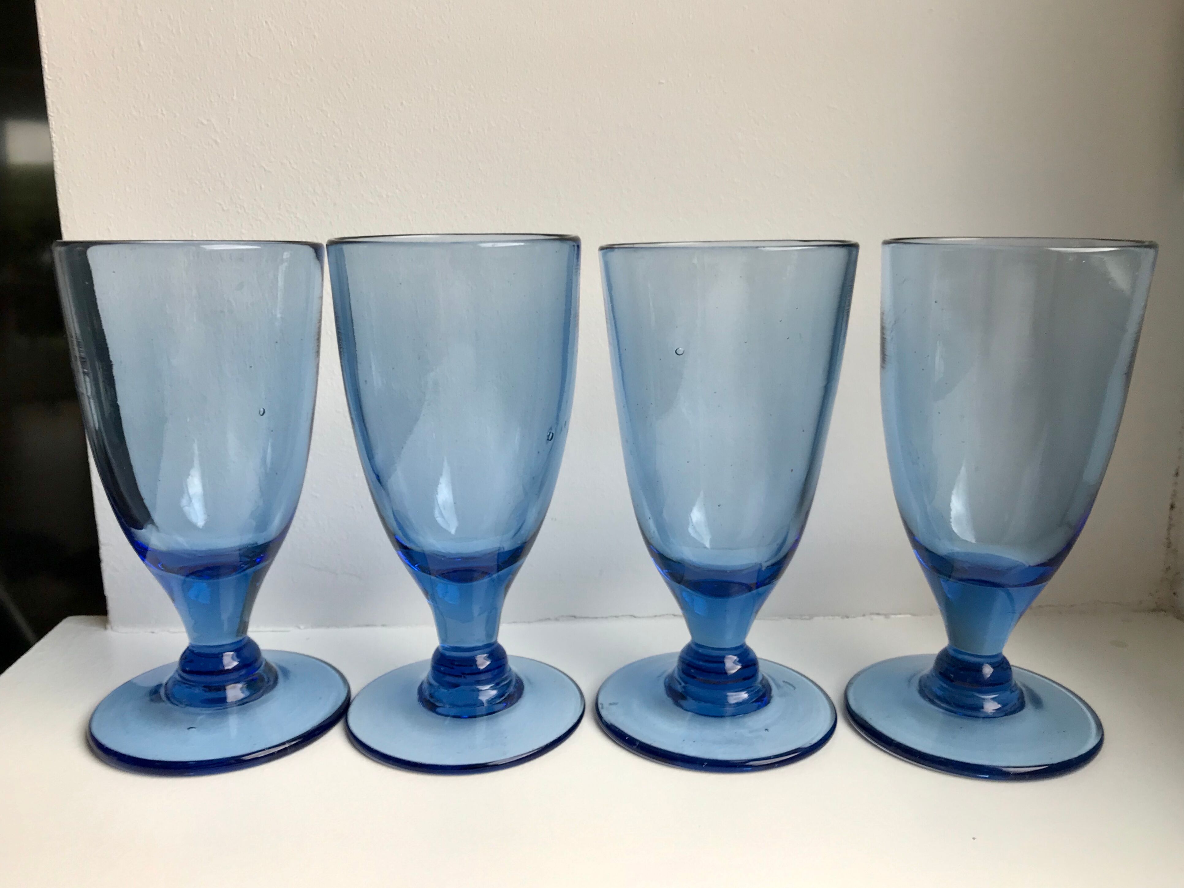 Set of 4 20s blue molded glass foot glasses