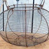 Old basket has wire eggs