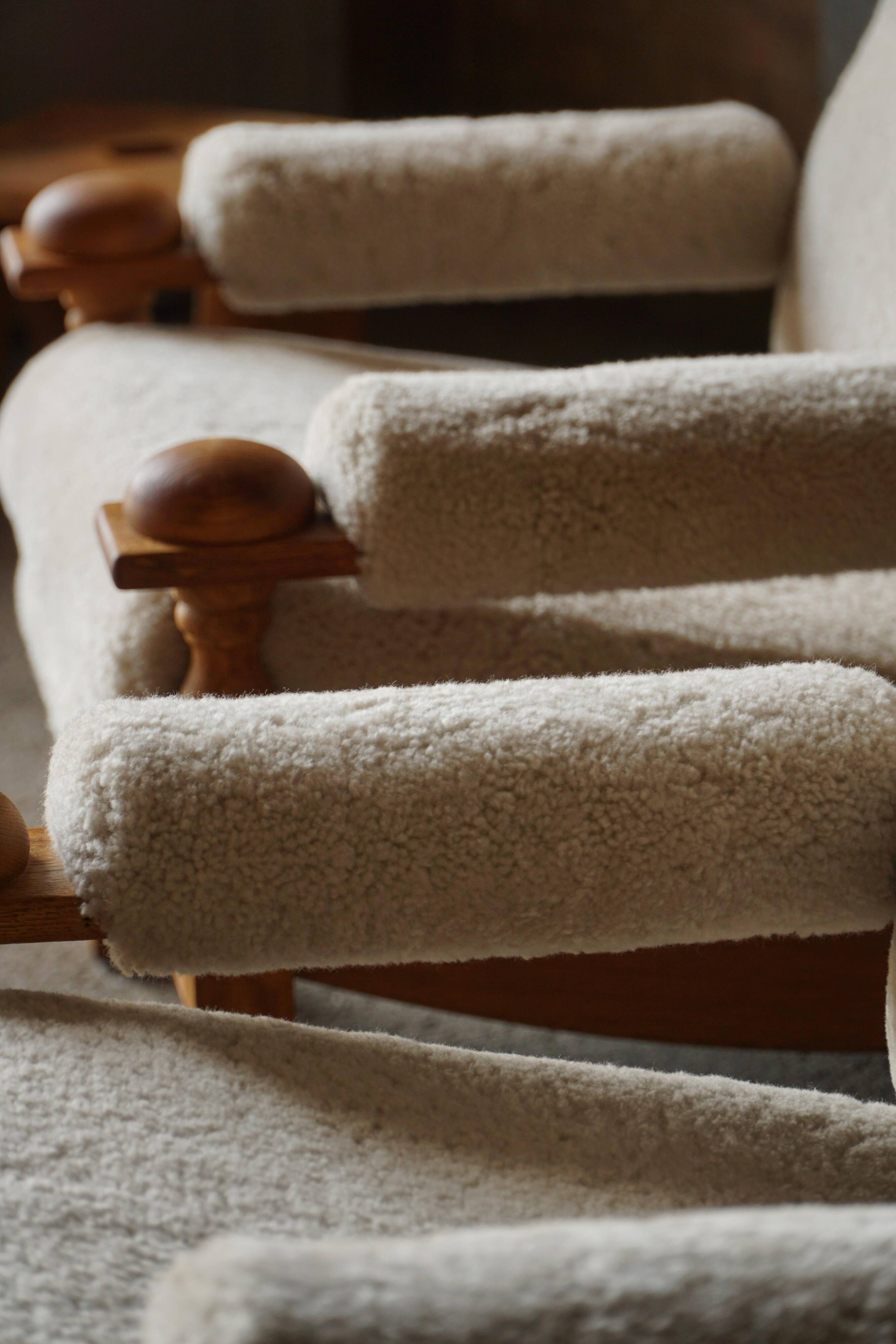 Henning Kjærnulf, lounge chairs in oak and lambswool, mid-century Danish, 1960s.