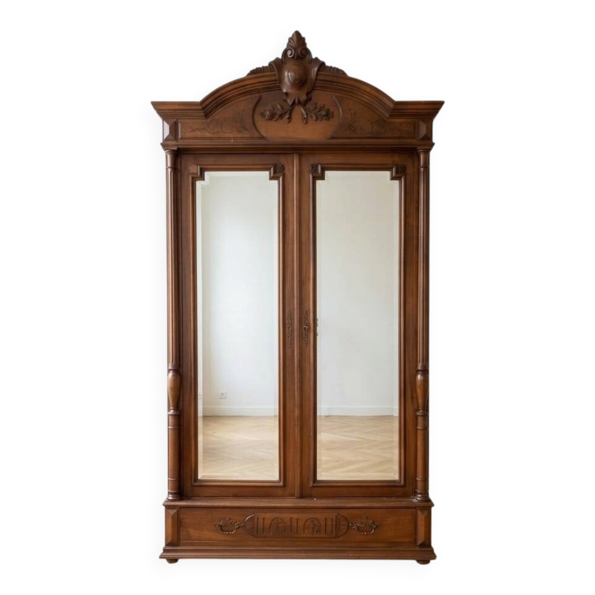 Antique walnut wardrobe with bevelled mirrors.