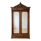 Antique walnut wardrobe with bevelled mirrors.