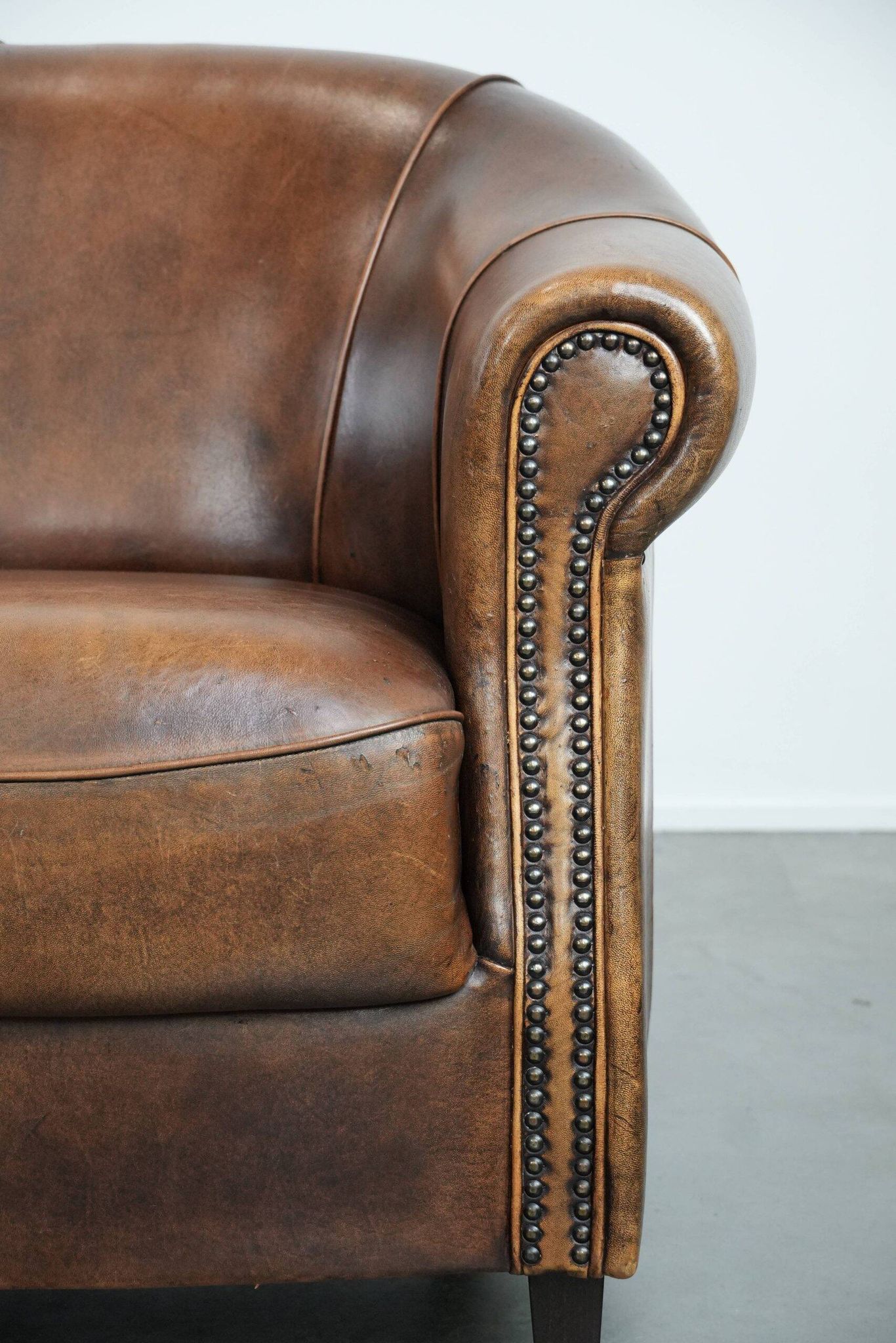 Characterful vintage sturdy 2-seater club sofa made of sheepskin leather