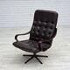 Fauteuil pivotant scandinave des années 1970, en cuir patchwork d'origine.