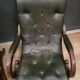 Pair of English Chesterfield armchairs in leather and solid wood