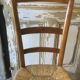 Chaise basse paillée de nourrice en merisier