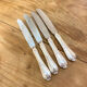 Series of 4 silver metal rocaille knives