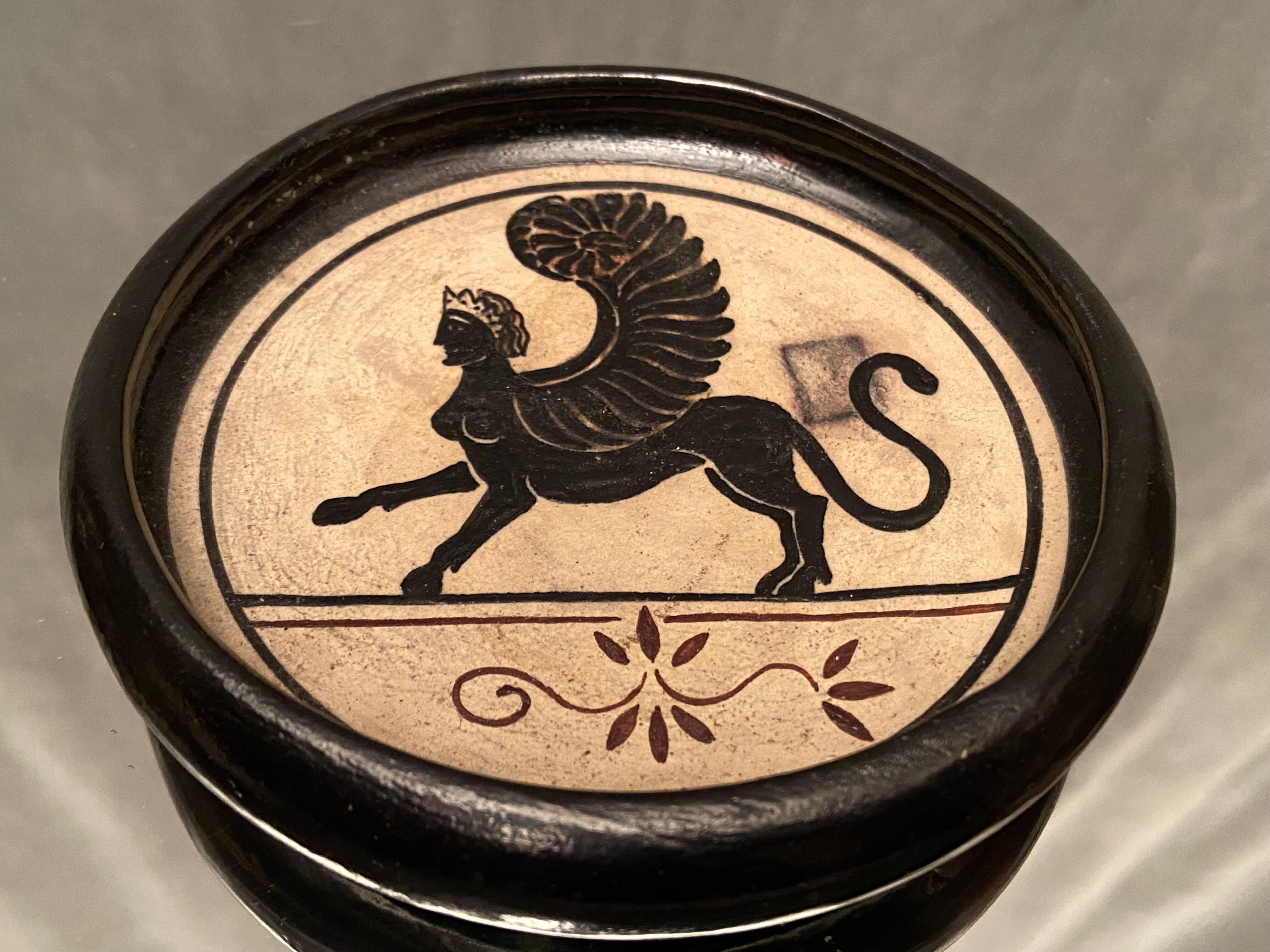 Cup decorated with winged sphinx in Ciboure sandstone signed Marie Fernandez