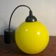 Yellow opaline globe pendant light from the 70s