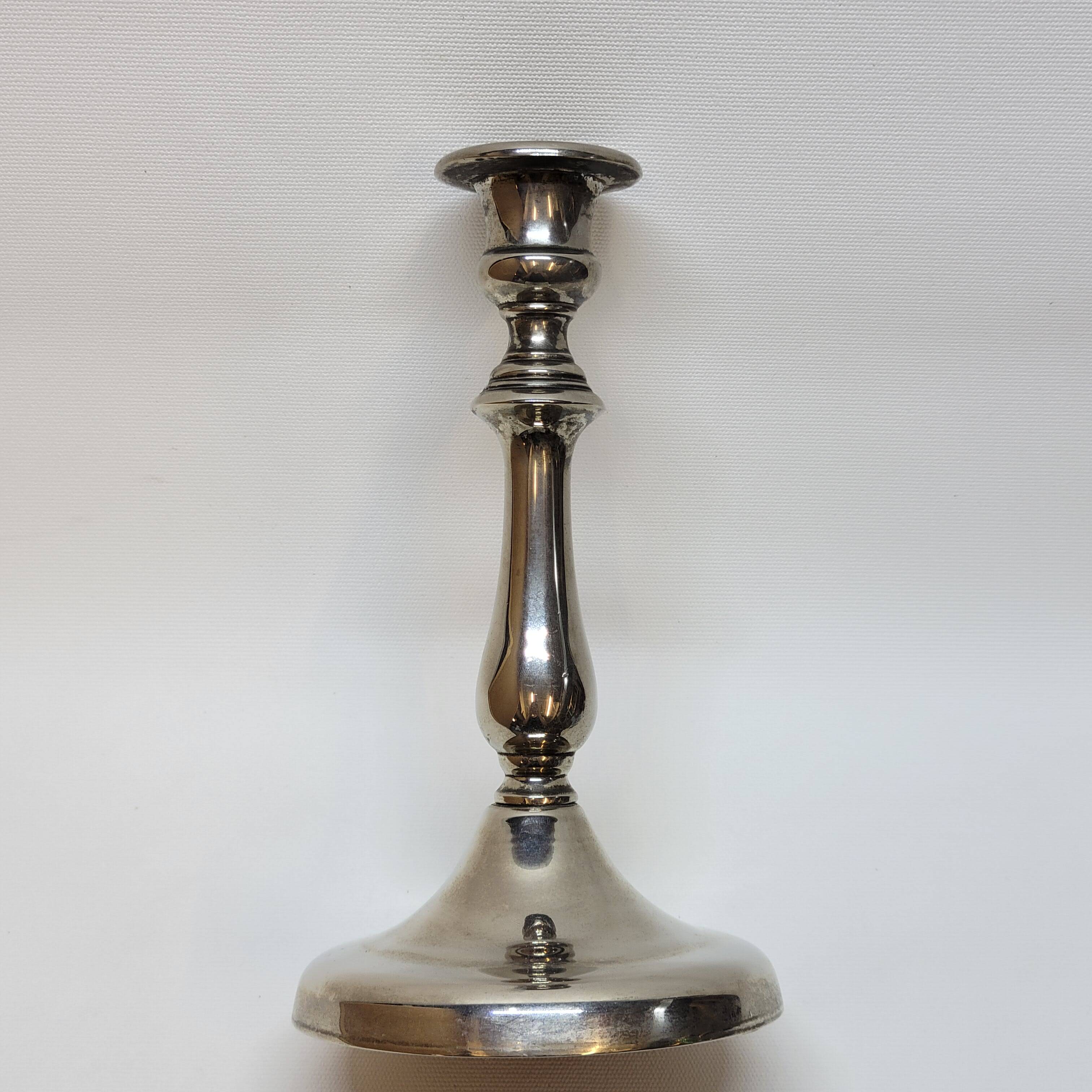 Old candle holder in silver metal