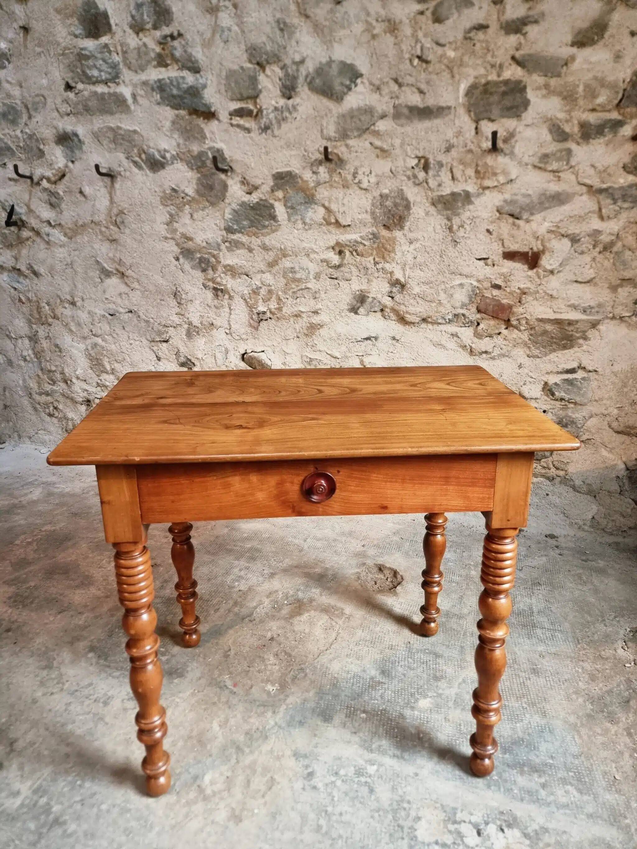 Small antique French writing table in walnut with a drawer, around 1900.
