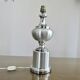 Brushed aluminum and chrome lamp typical of the 70s