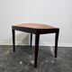 Vintage wooden ottoman from the 1940s with a silk top and studded trim.