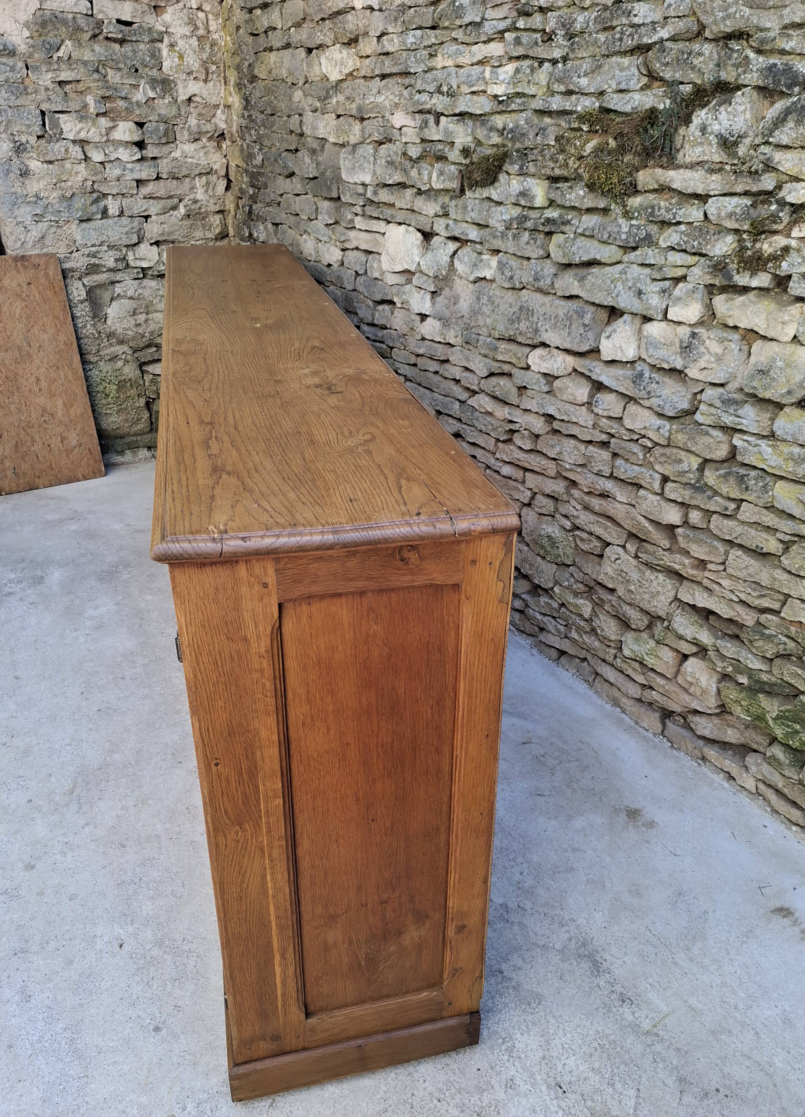 Oak workshop furniture with sliding doors.