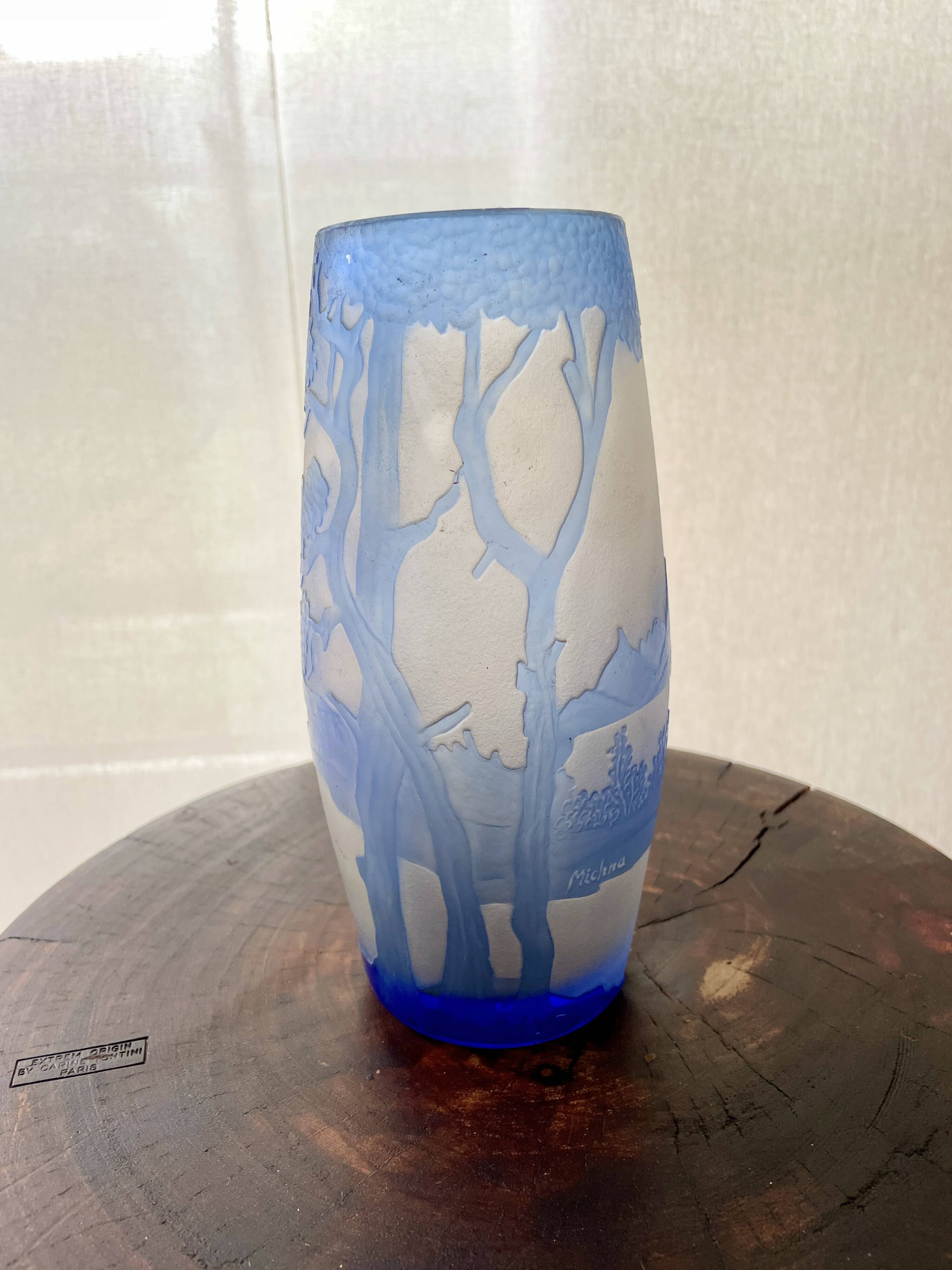 Transparent vase with a blue pattern featuring trees, signed MICHNA.