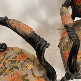 Pair of Napoleon III armchairs, in blackened wood, floral patterned fabric