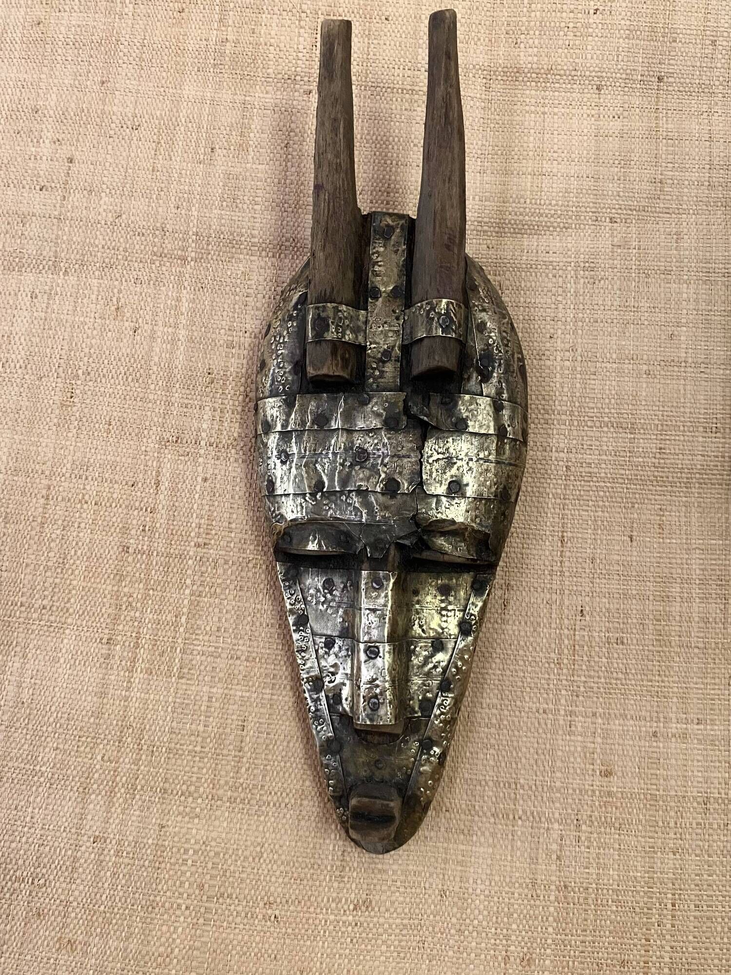 Ancient wooden and brass mask