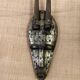 Ancient wooden and brass mask