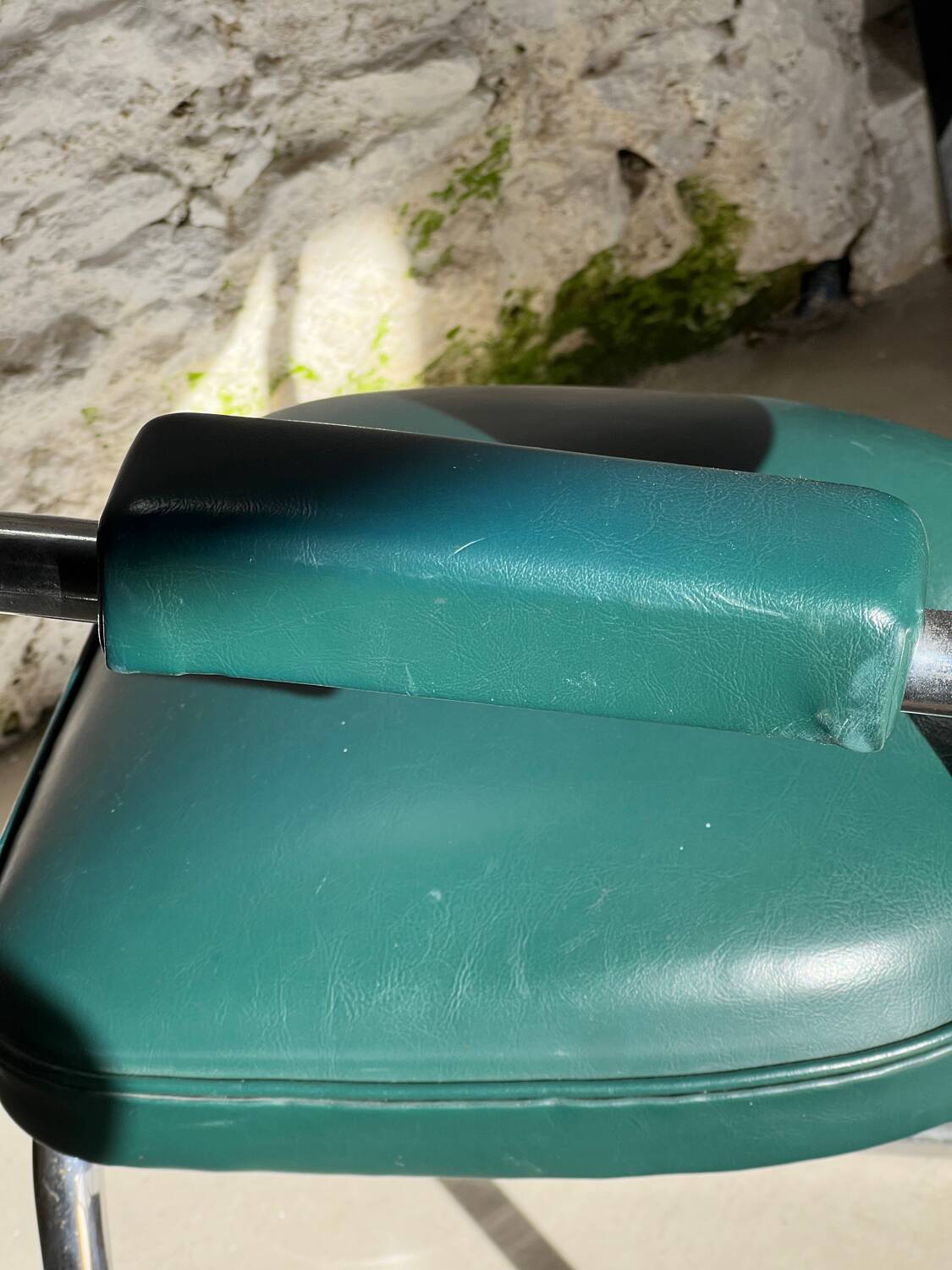 Pair of green vinyl and chrome armchairs, mid-century