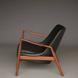 Fauteuil Seal en cuir et teck Ib Kofod-Larsen pour OPE, Suède, années 1960.