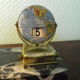 Perpetual calendar on marble base with marble patinated regulated decoration, 60s