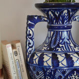 White hand-painted ceramic vase with blue patterns