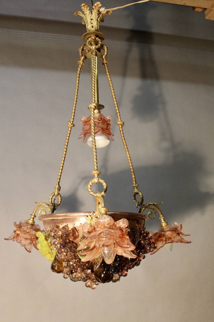 Bronze three-armed chandelier with a grape decoration.