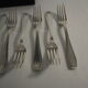 12 SFAM forks in its dark chocolate case