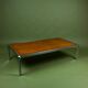 Vintage 1970s coffee table in chrome and burl wood.