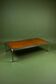 Vintage 1970s coffee table in chrome and burl wood.