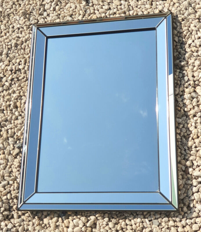 Vintage mirror deknudt with 70's parecloses