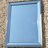 Vintage mirror deknudt with 70's parecloses