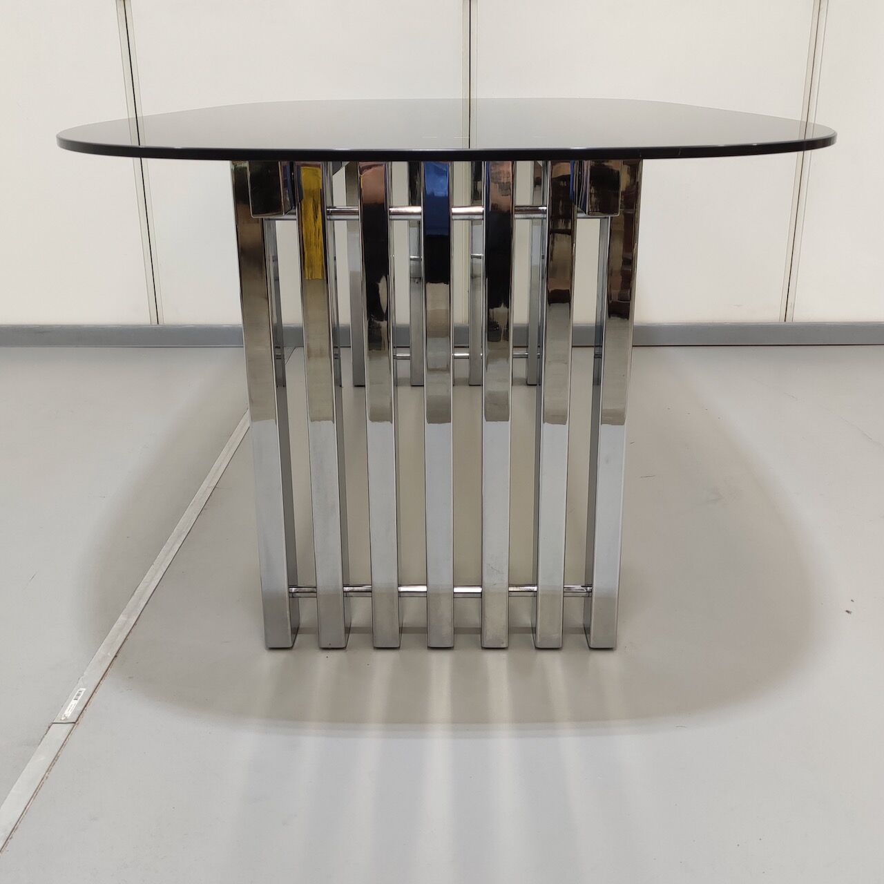 Chrome base diningroom table with smoked glass oval top