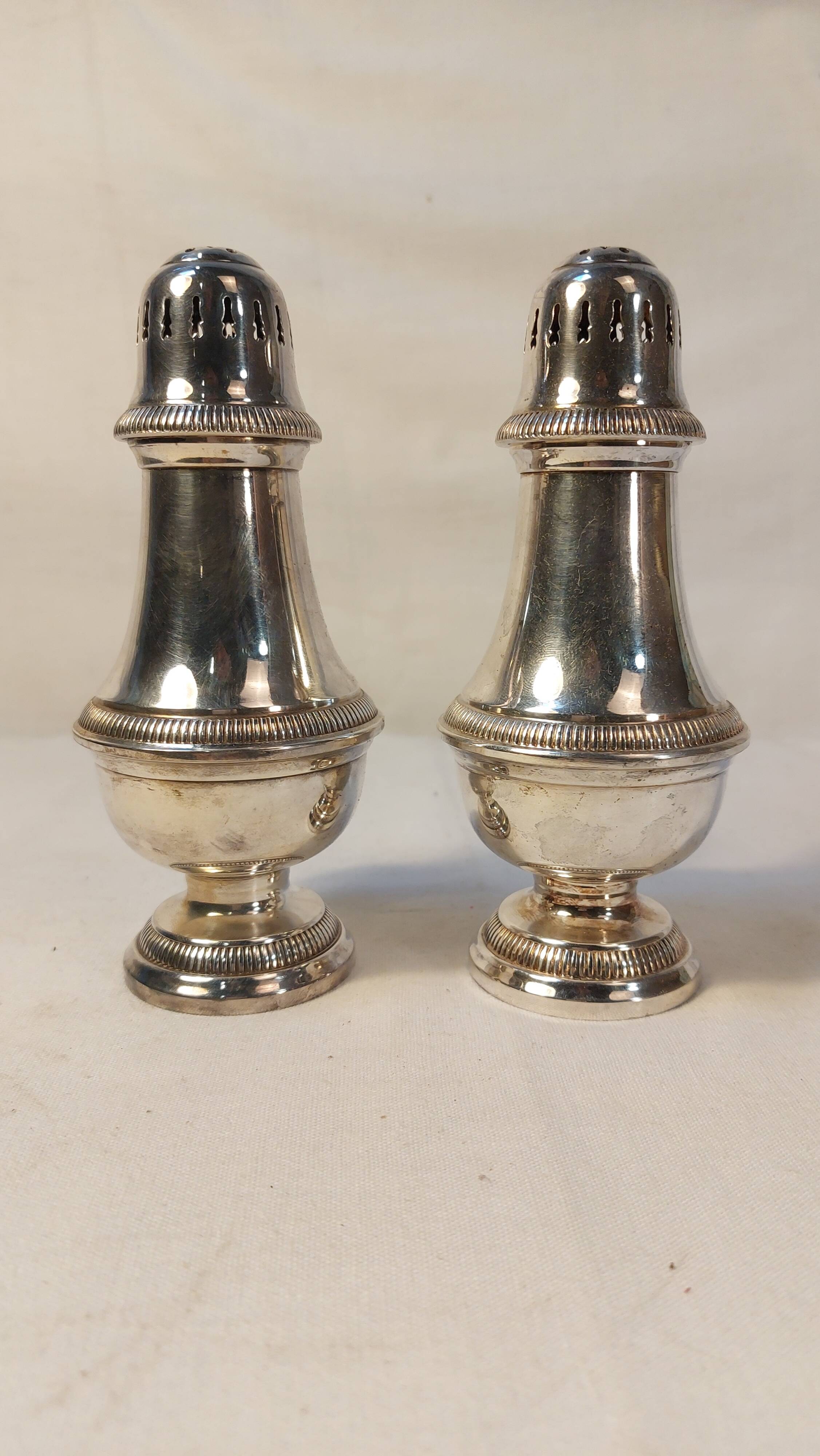 Set of two silver metal sprinklers