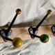 Coat rack with 5 double metal hooks and vintage wooden balls from the 1950s.