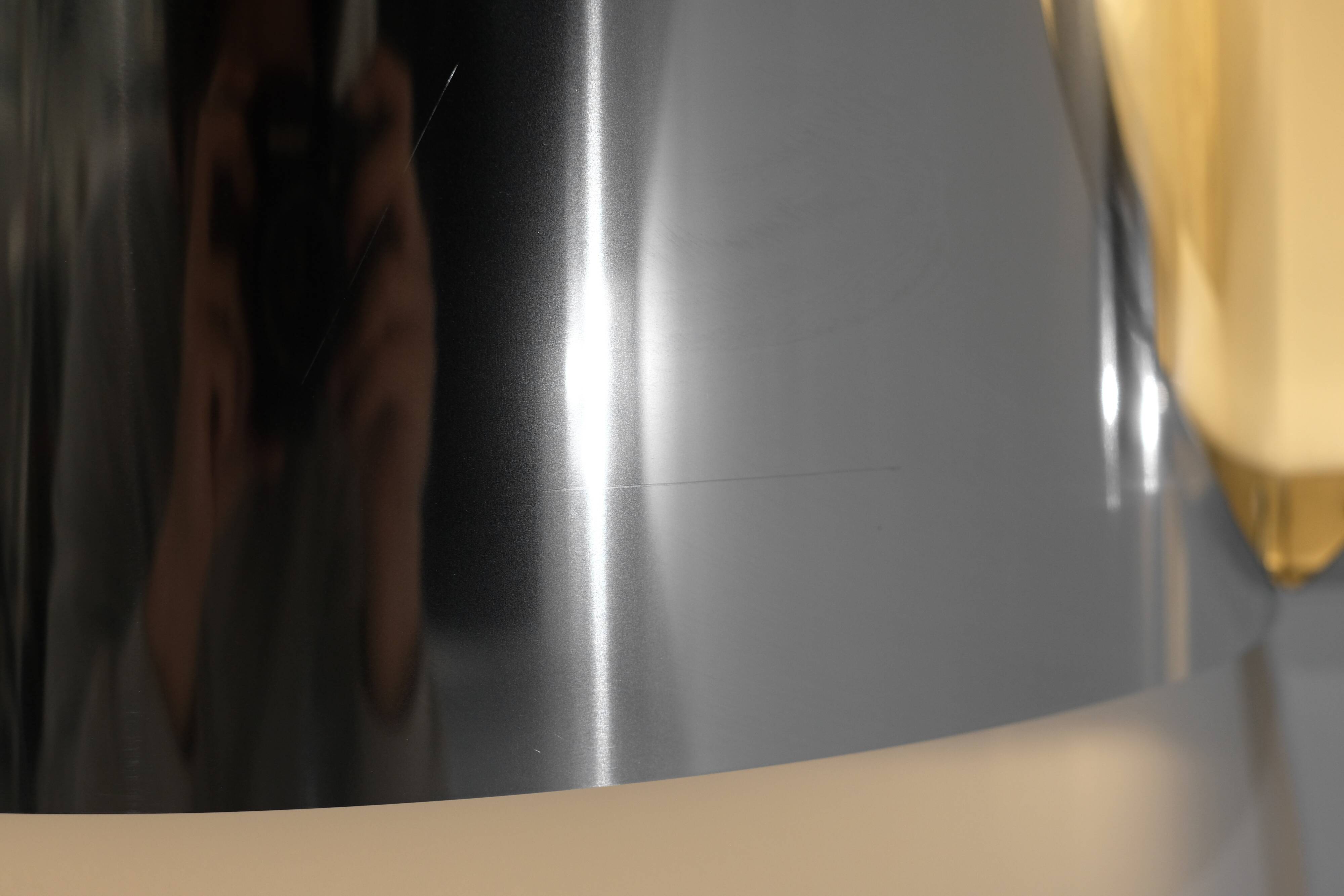 Contemporary wall light in stainless steel and metal.