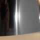 Contemporary wall light in stainless steel and metal.