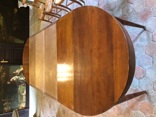 Solid oak table with 3 extension cords, 6 oak chairs with straw seat