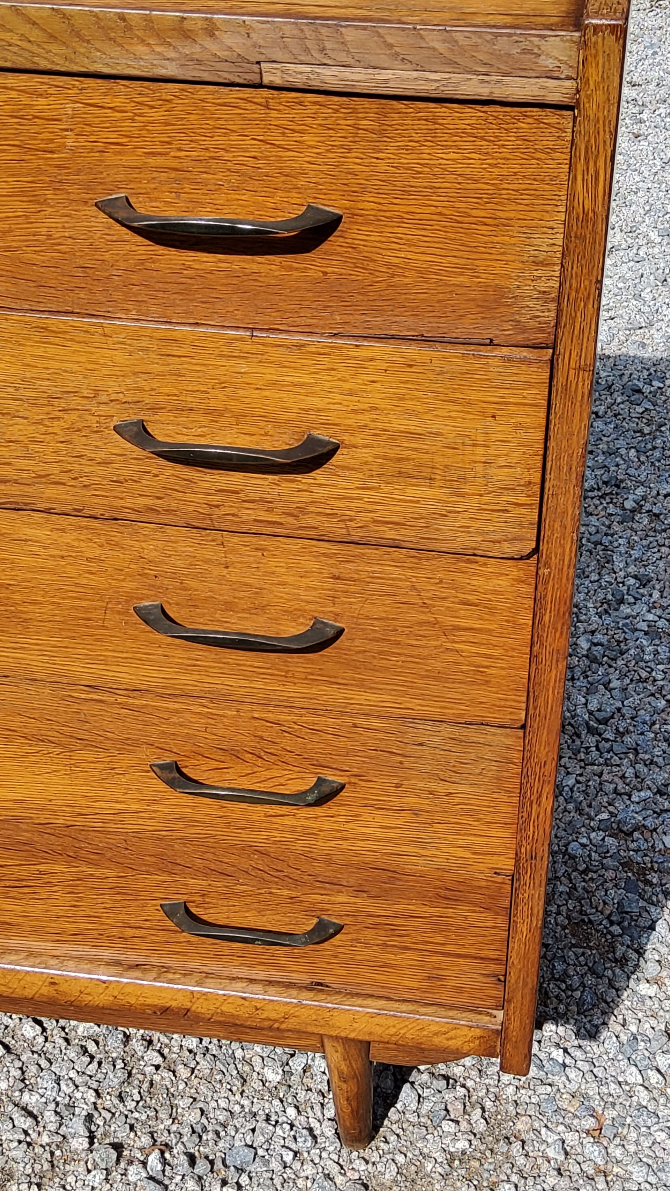 Chest of drawers of the 50s in golden blond oak 5 drawers conical feet