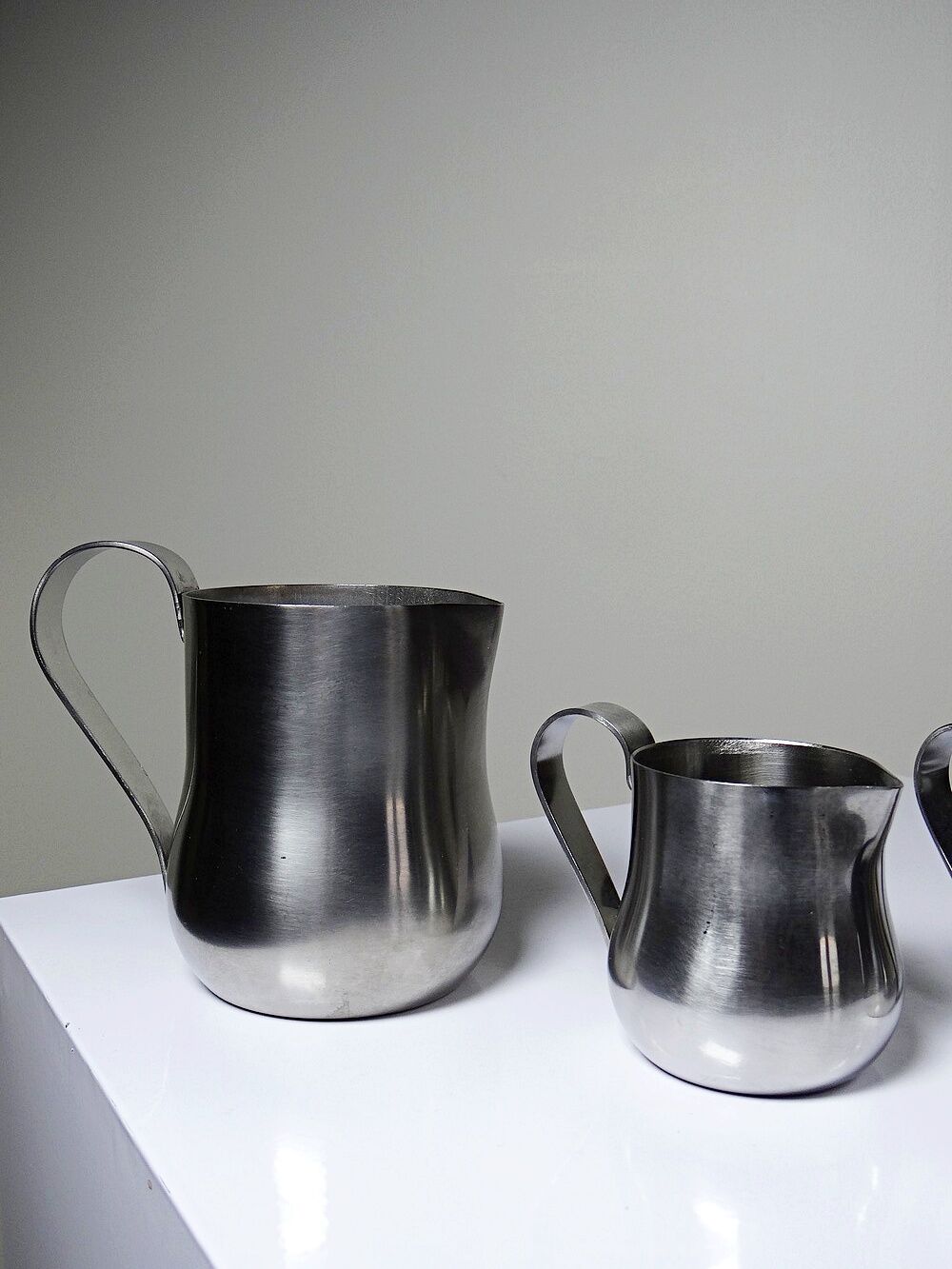 Set of 4 vintage bar measures in brushed stainless steel from the 60s-70s.