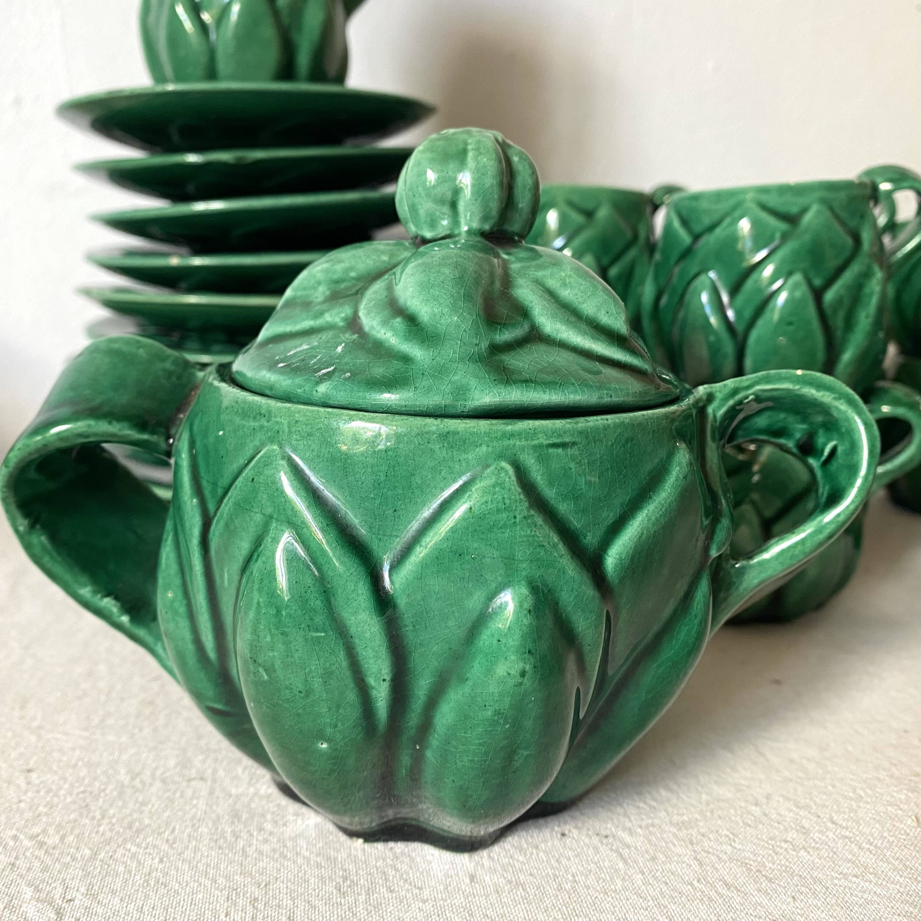 Antique slip cups with saucers, sugar bowl and milk pitcher