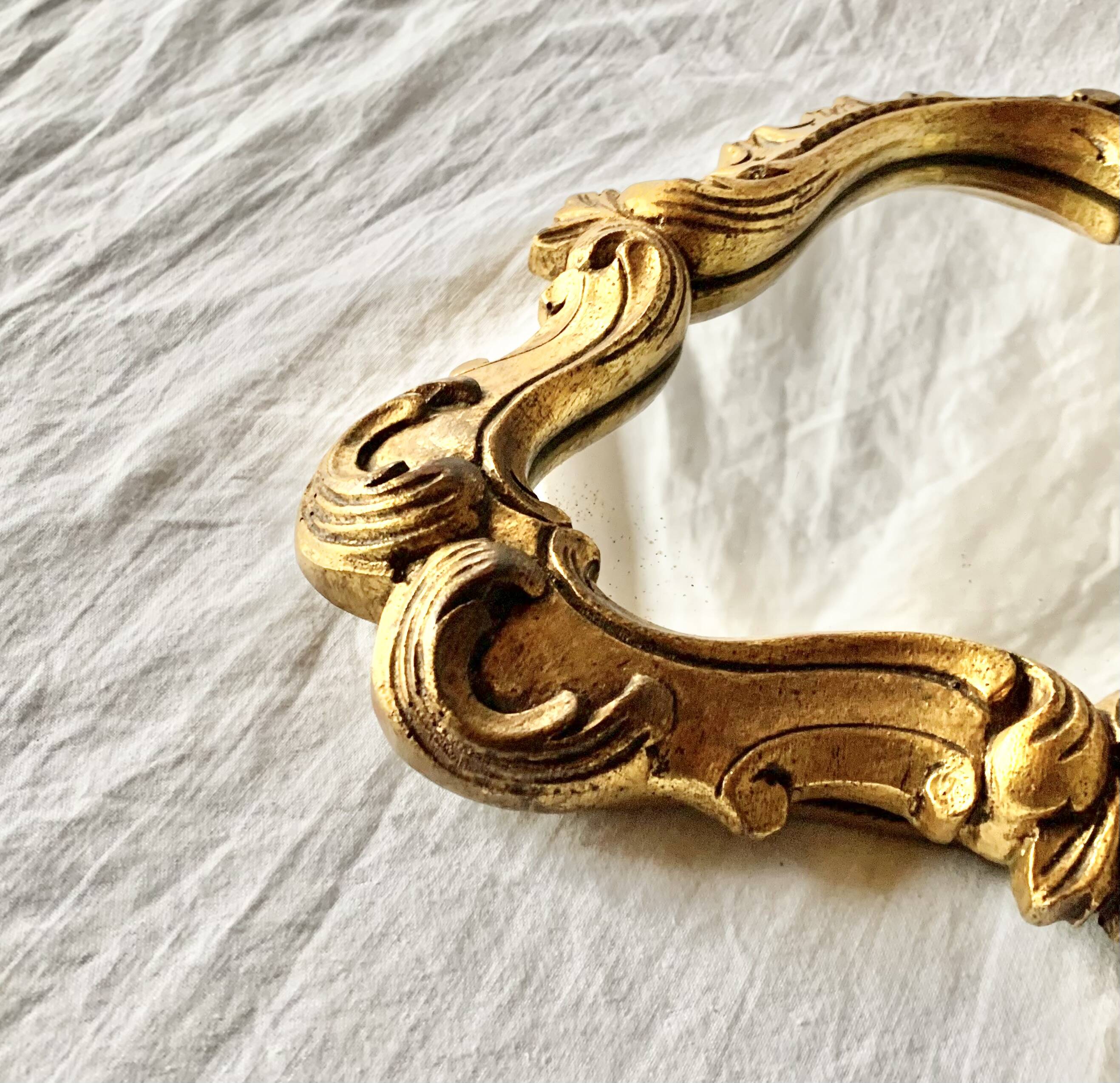 Rococo wall mirror in golden resin