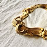 Rococo wall mirror in golden resin