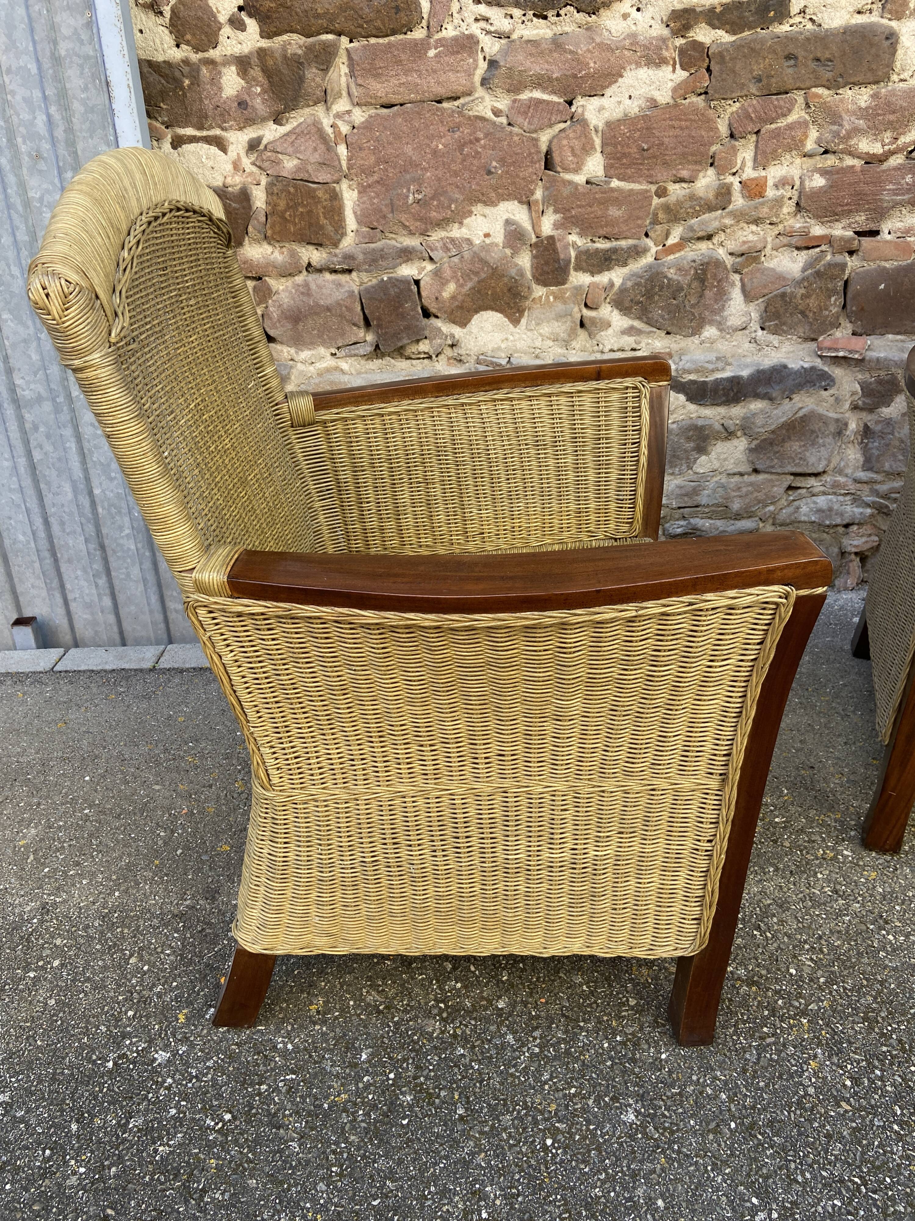 pair of Colonial-style wood and rattan seats
