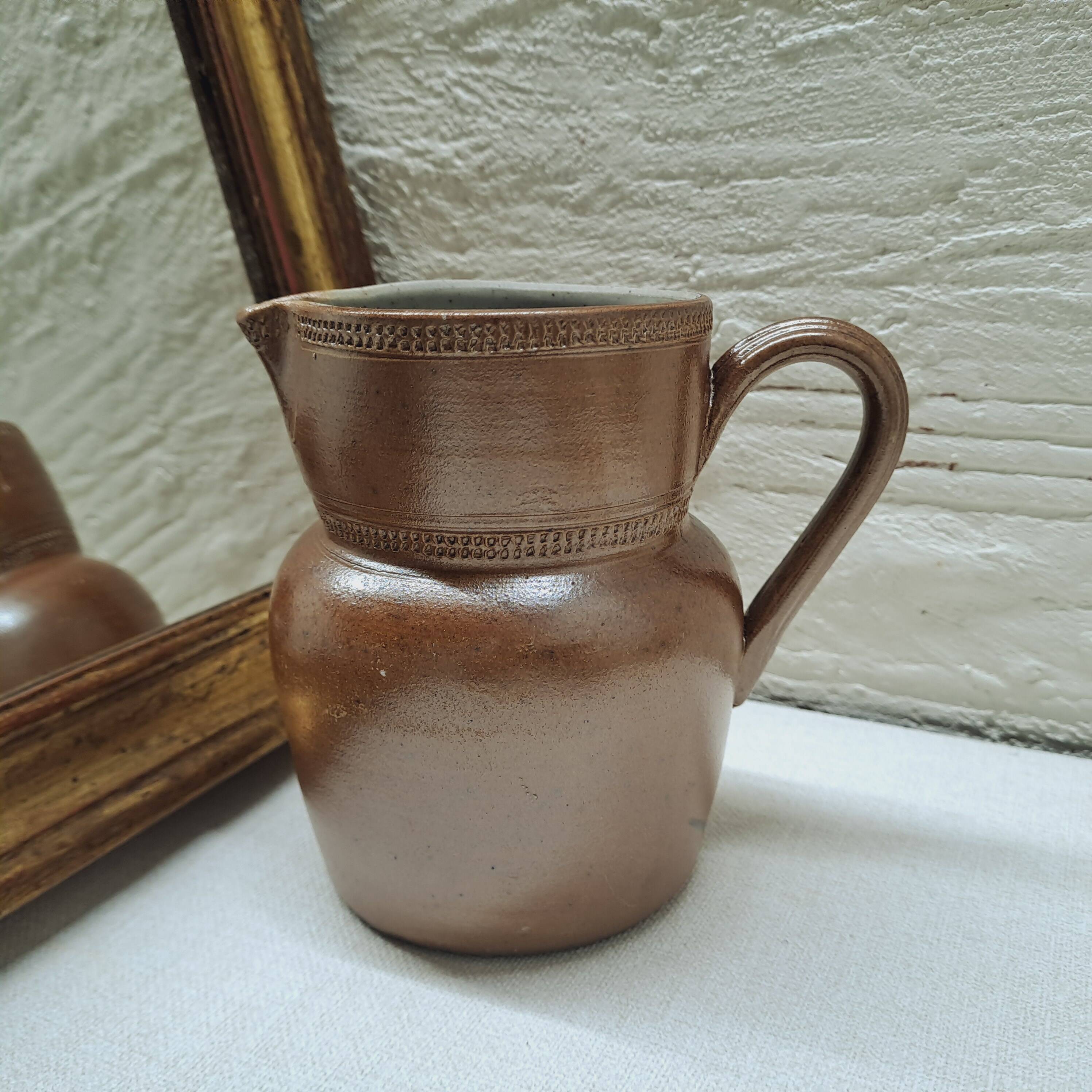 Antique stoneware milk jug