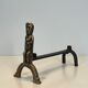 Pair of bronze andirons with seated shamans monogrammed Anton Prinner