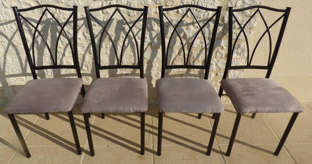 4 black metal chairs with high backs and gray suede tops