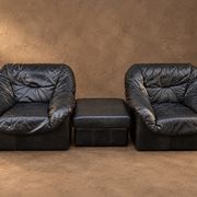 Leather armchairs and matching pouf, Italy, circa 1980