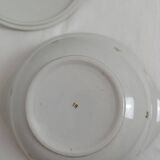 White earthenware soup tureen with a golden pattern.